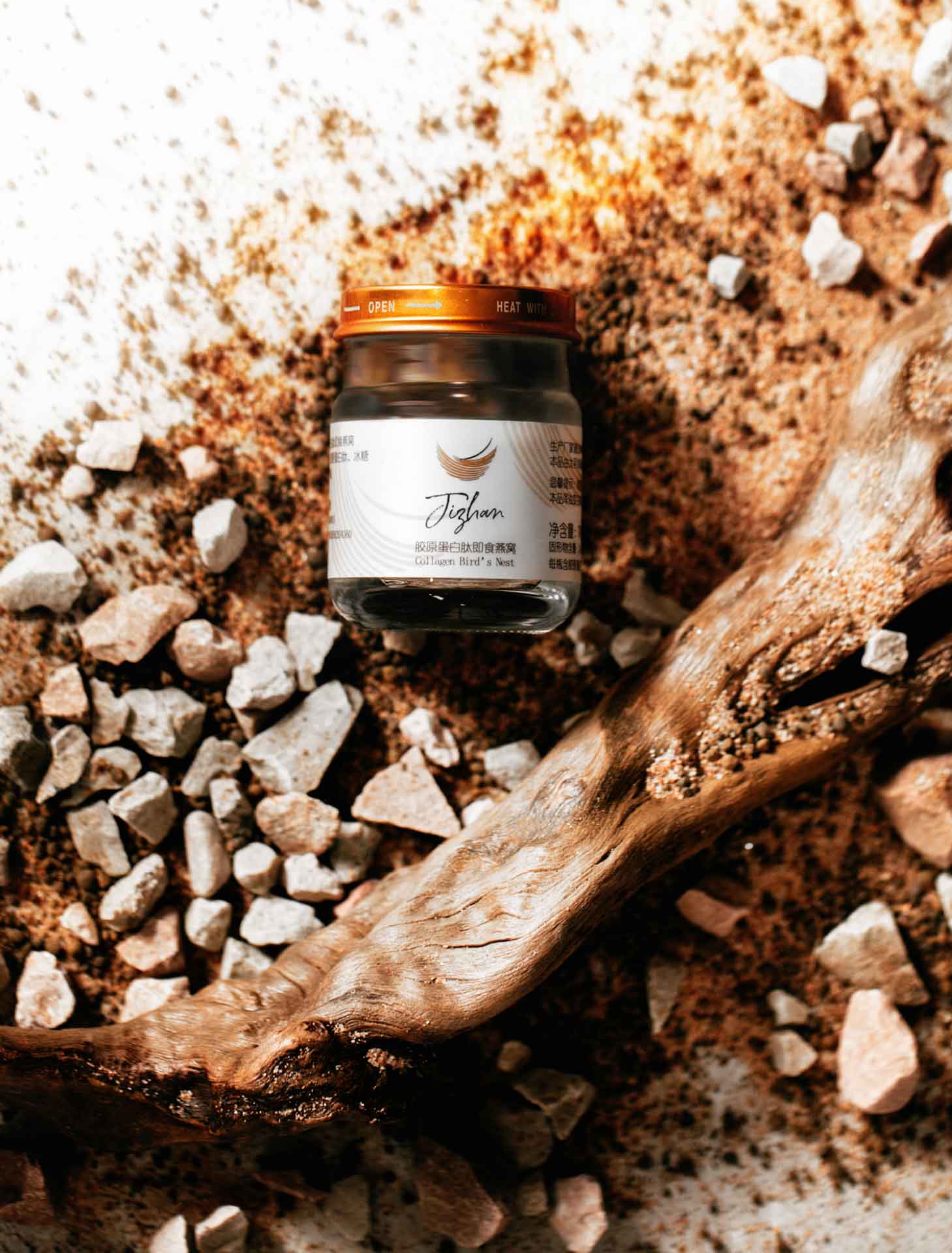 botanical set design with a branch, stones and sand for edible birds nests skincare cosmetics by Shanghai florist Daria Bokova