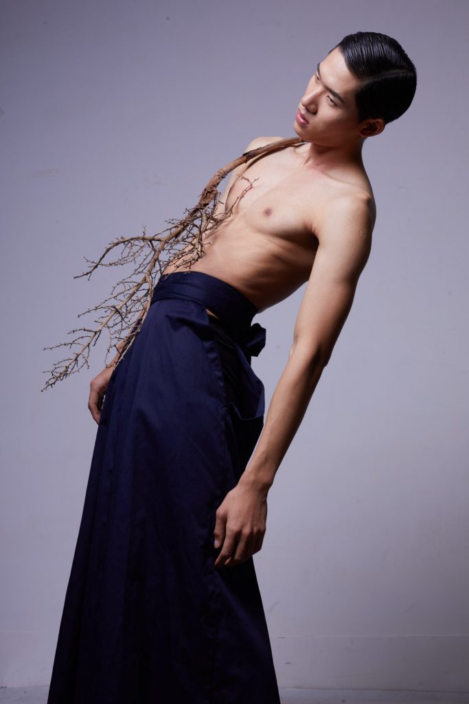 Branches in the guy's body Fashion photo shoot with flowers