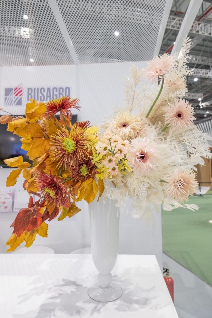 Ombre fall flower arrangement with white gerbera, yellow and orange chrysanthemum and leaves for reception by Shanghai florist Daria Bokova