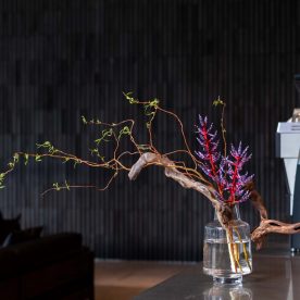 spring flower arrangement in vase with blue rain bromeliad and branches by Florist and set designer in Shanghai China Daria Bokova