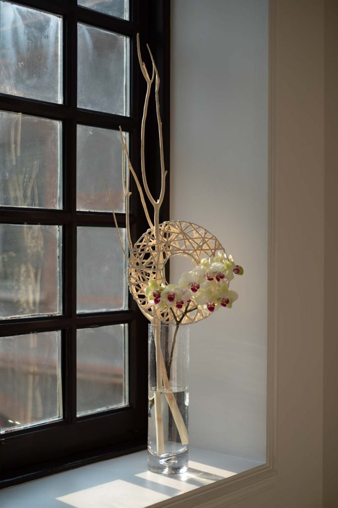 flower arrangement in vase with white phalaenopsis orchid by Florist and set designer in Shanghai China Daria Bokova